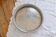 Large round vintage silver-plated metal tray, engraved and pierced.