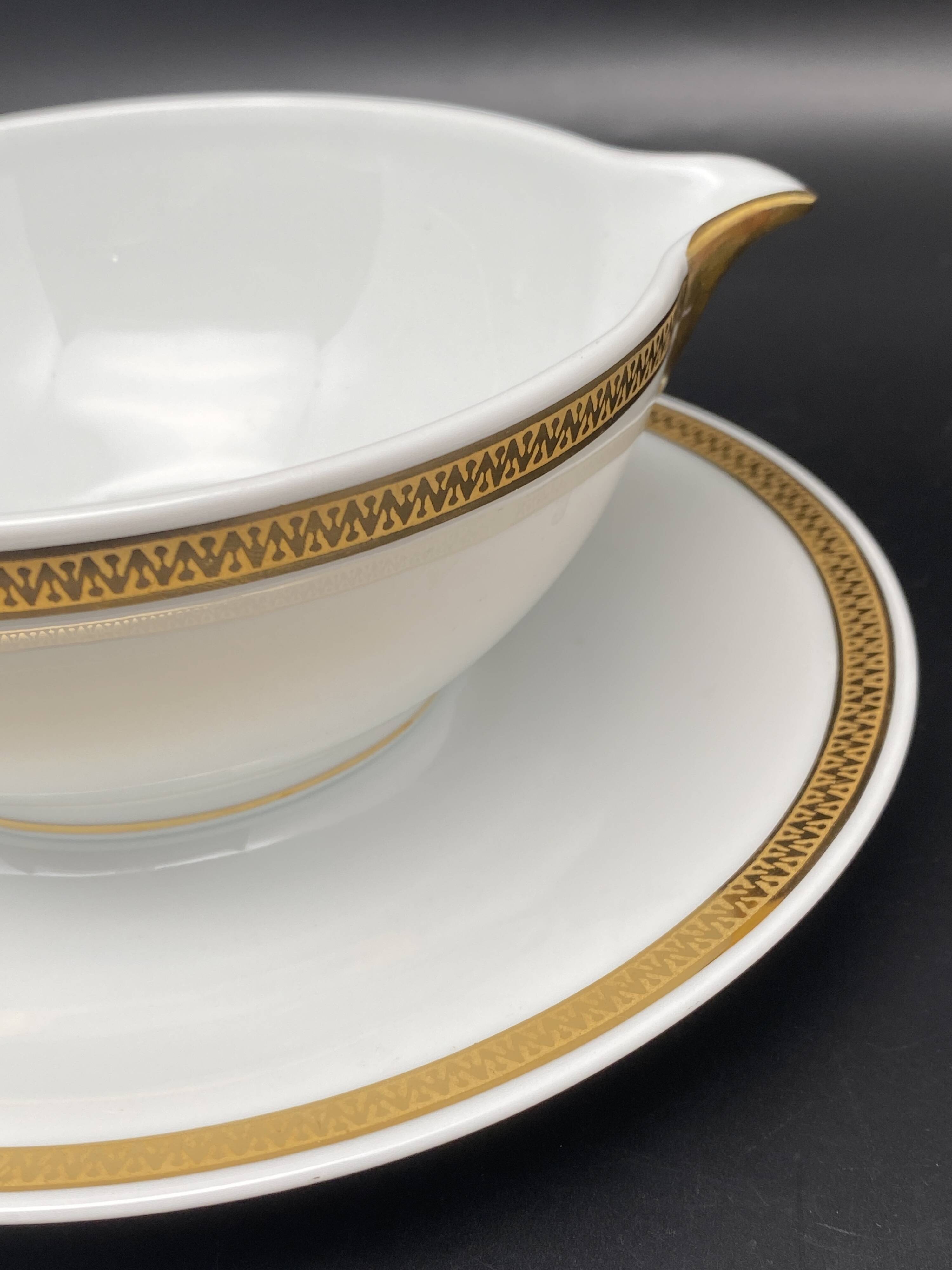 Limoges porcelain gravy boat with gold edging