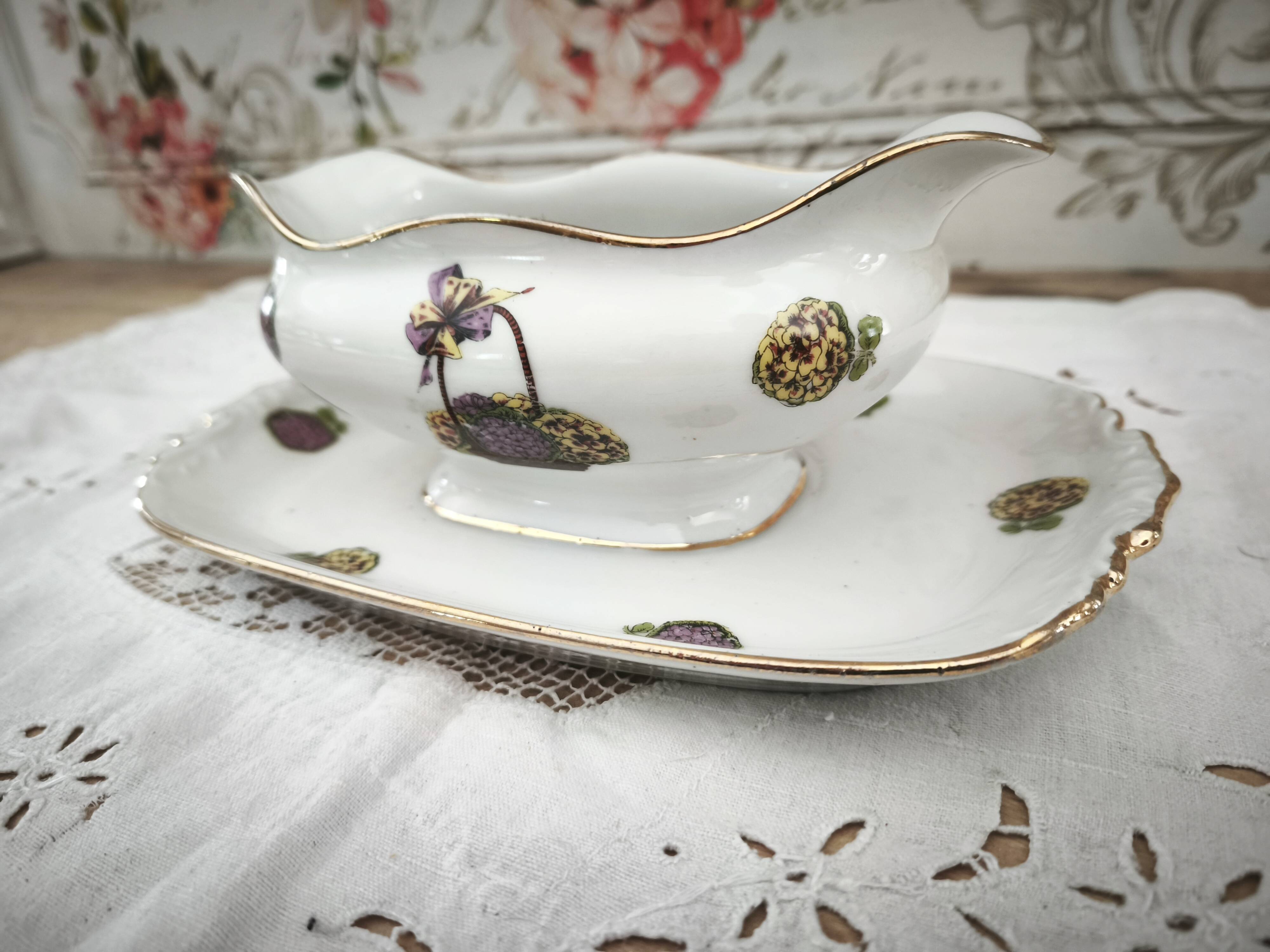 Sauce boat on a Limoges porcelain base with a hydrangea basket design.