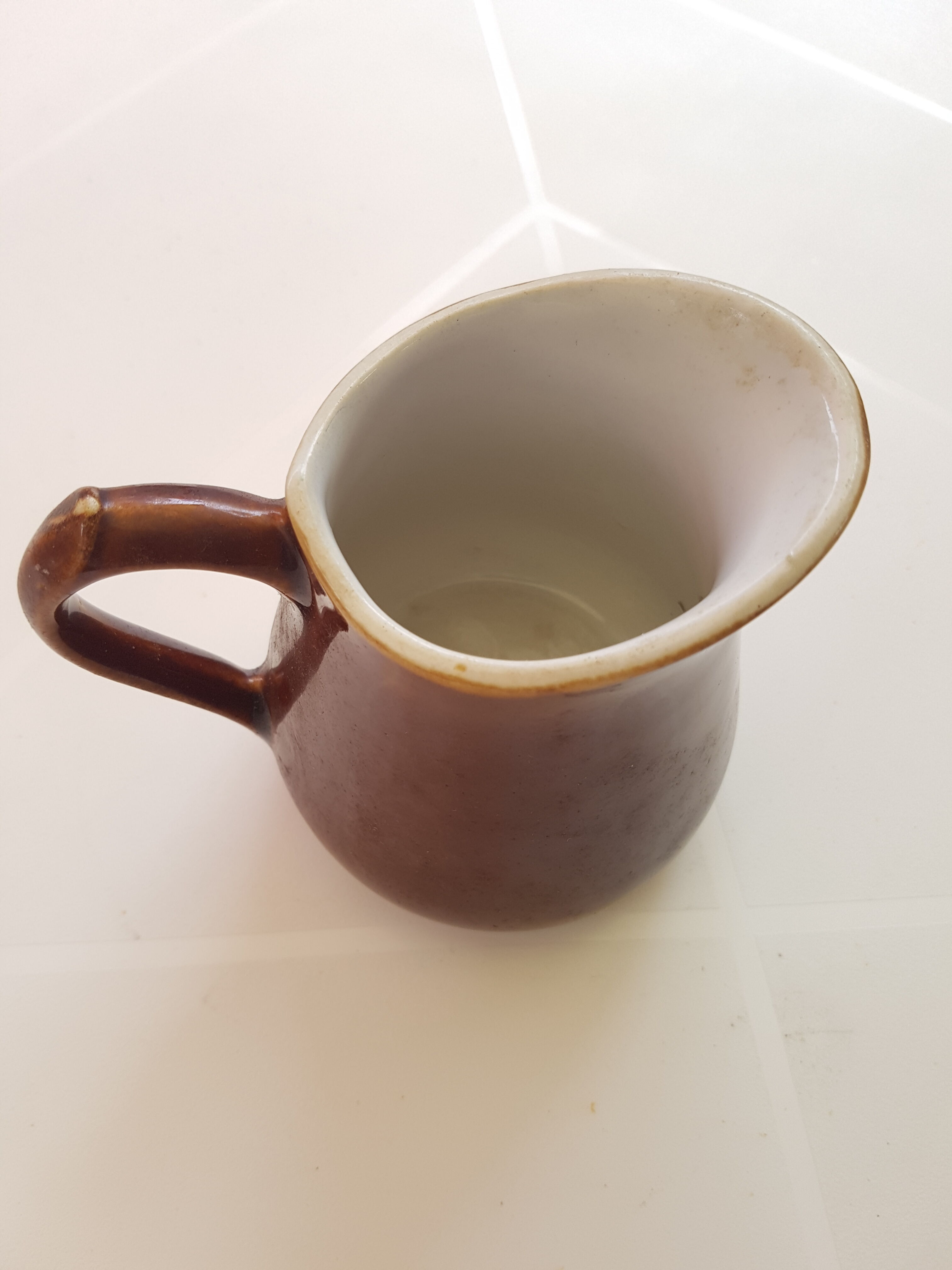 Vintage pitcher in enamelled sandstone from the 1960s