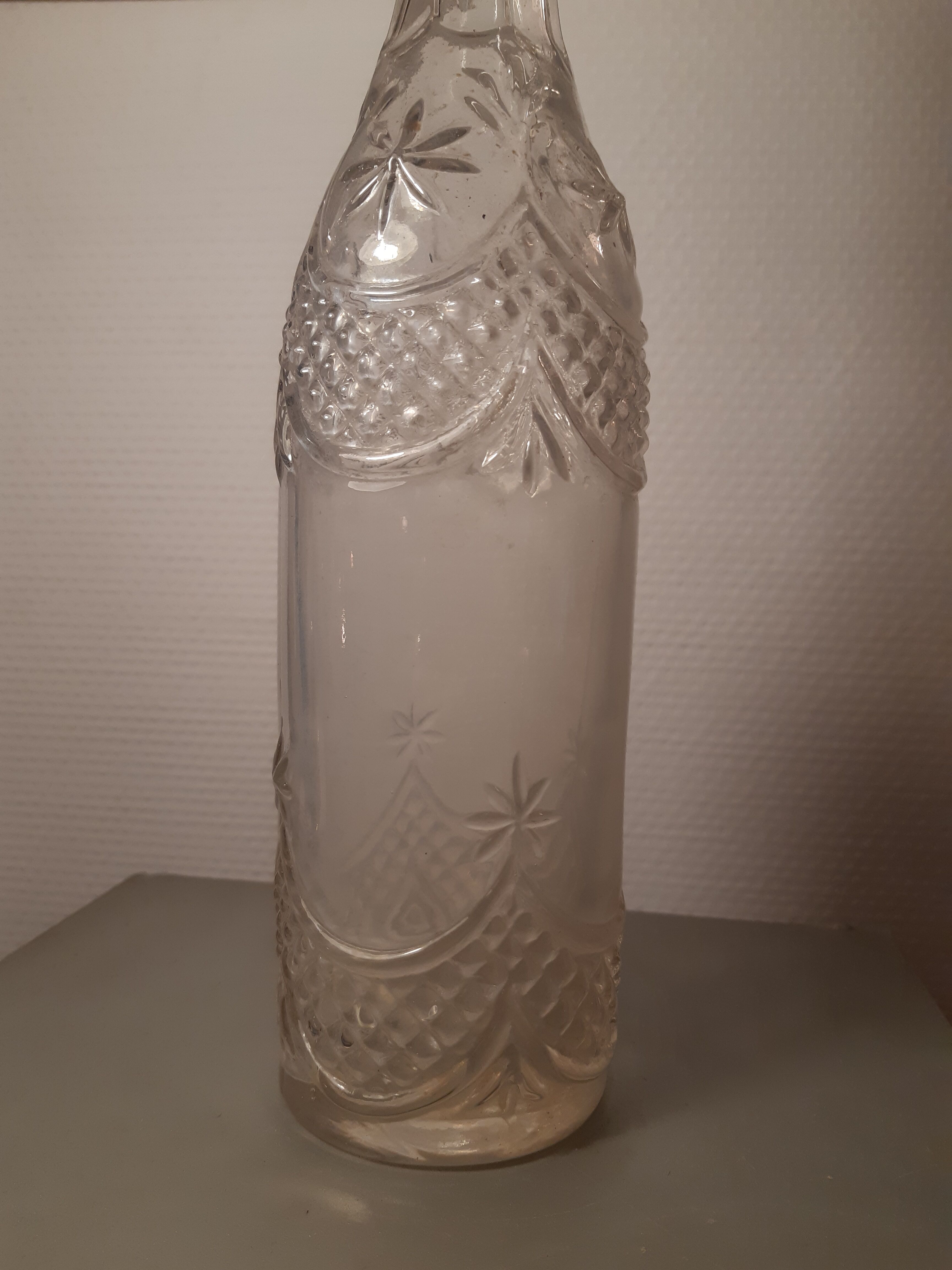 Engraved antique bottle