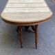 Round extendable dining table Napoleon III renovated in 19th-century oak.