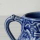 Old cream milk jug in slip