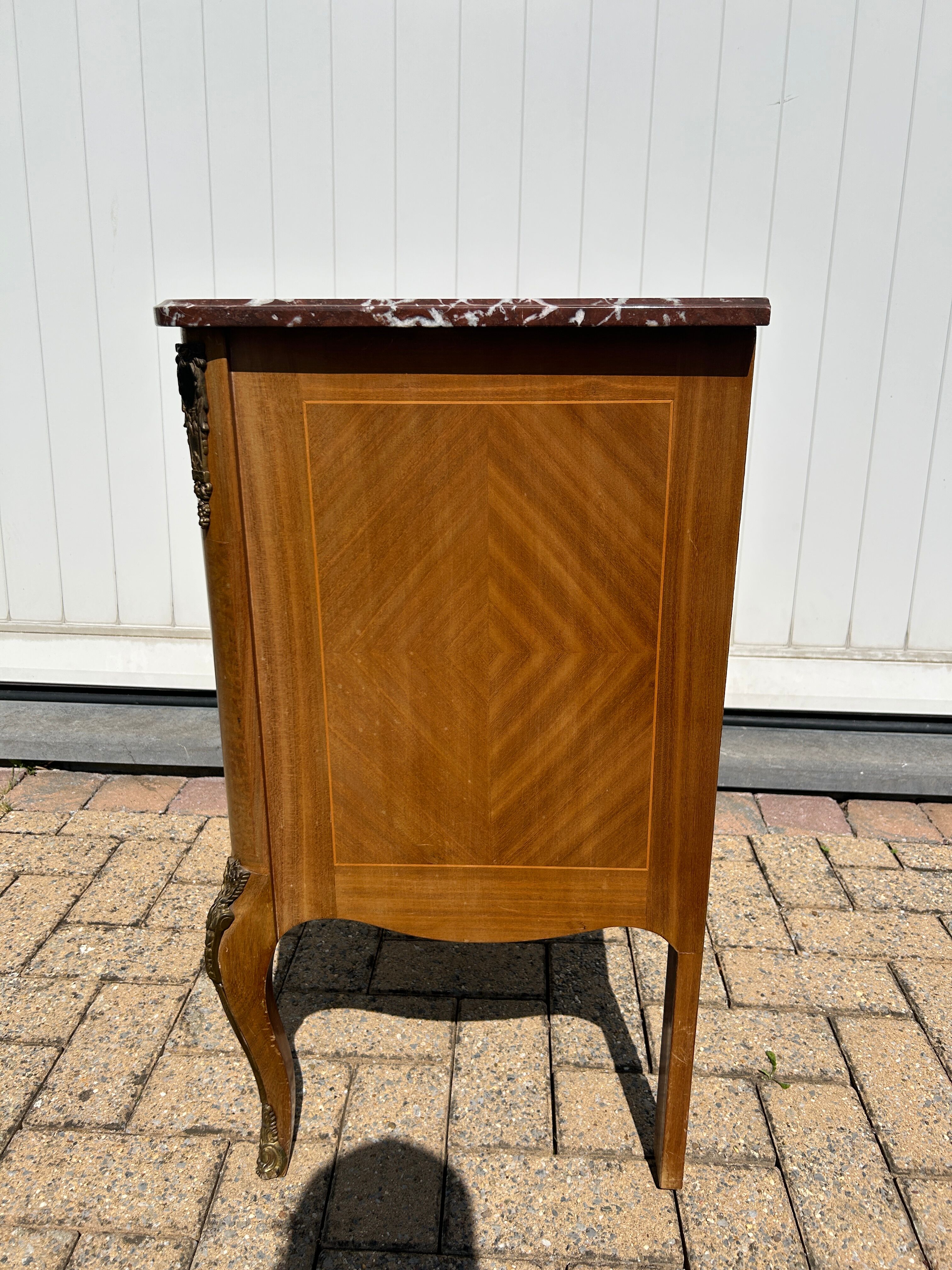 Marquetry commode in transitional style