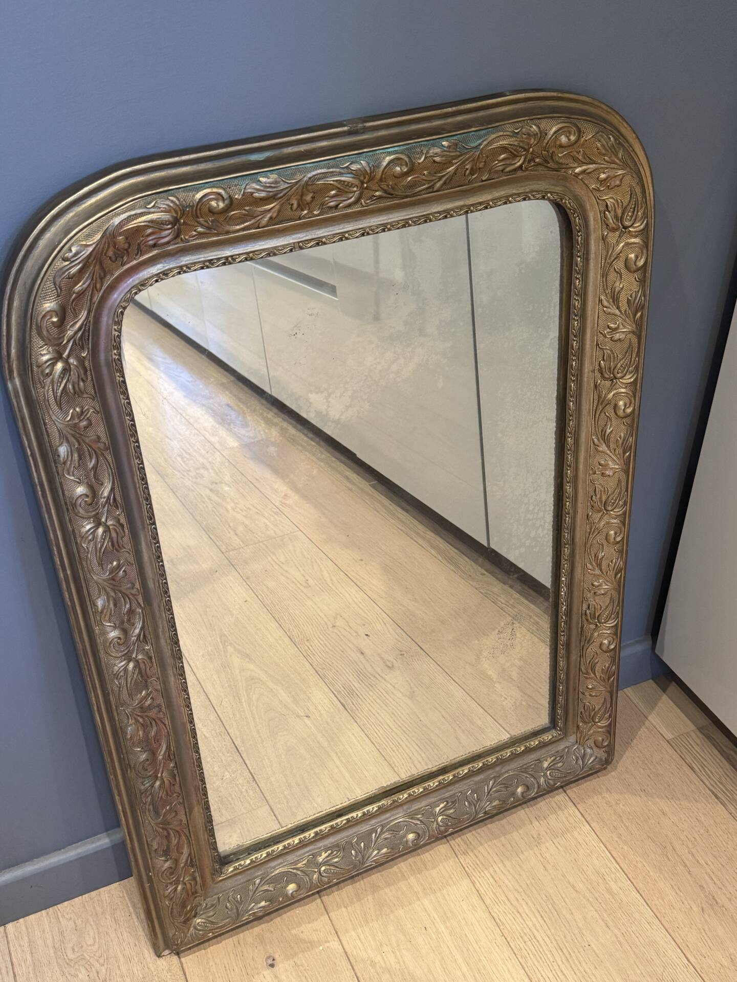 Golden mirror with mouldings