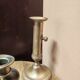 Set of three solid brass candle holders