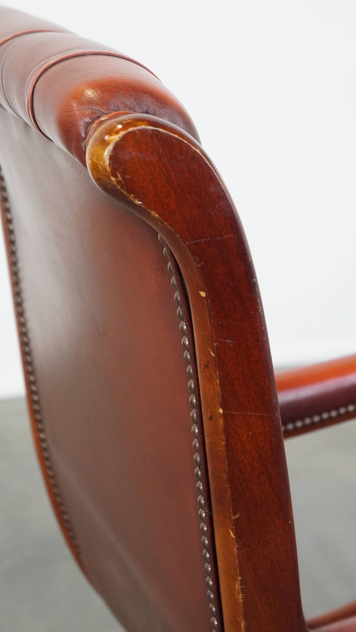 Red cowhide leather English Chesterfield armchair combined with wood