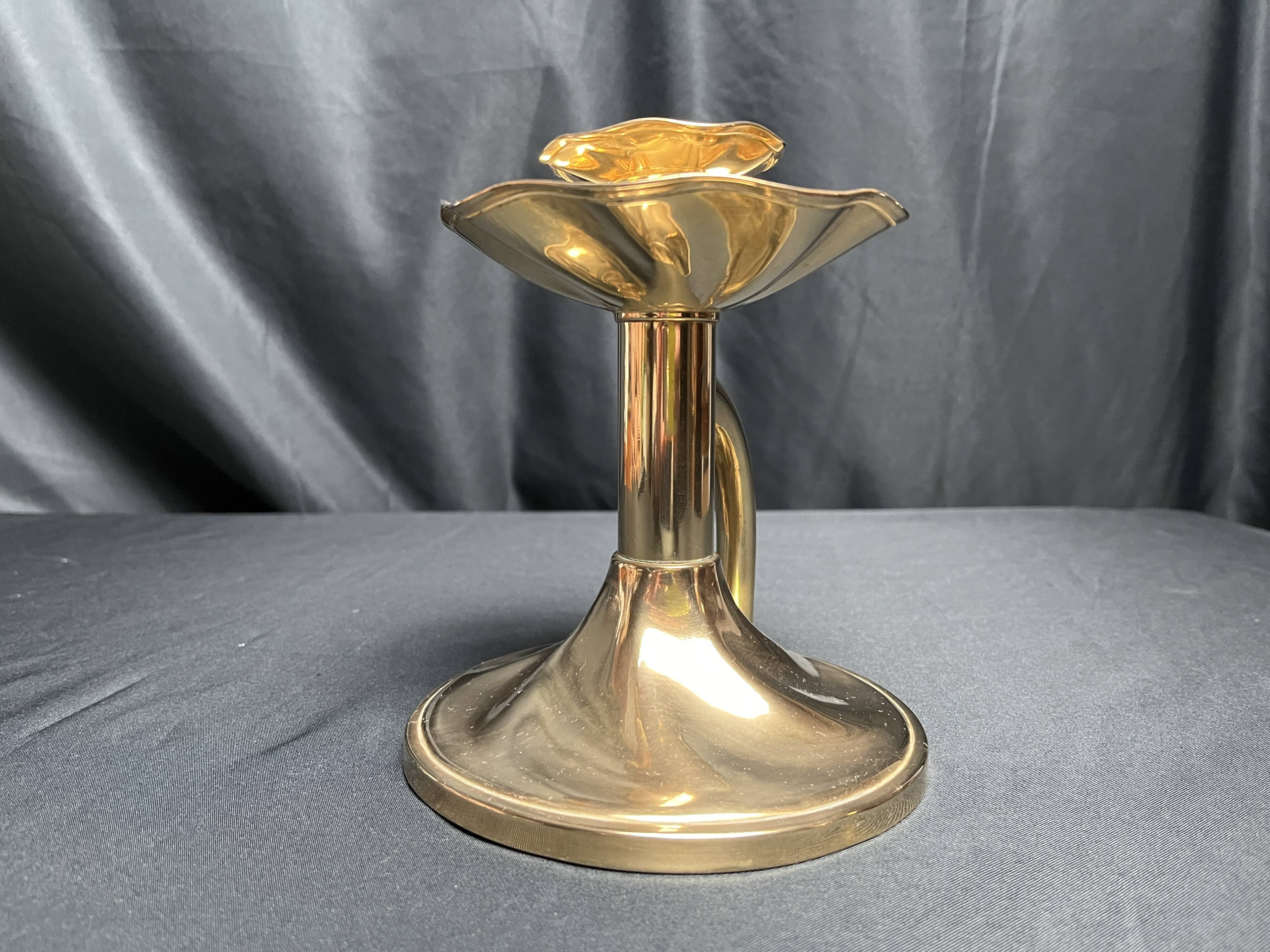 Brass candlestick in a fluted shape from the early 20th century.