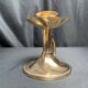 Brass candlestick in a fluted shape from the early 20th century.