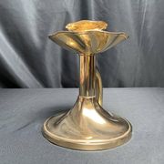 Brass candlestick in a fluted shape from the early 20th century.