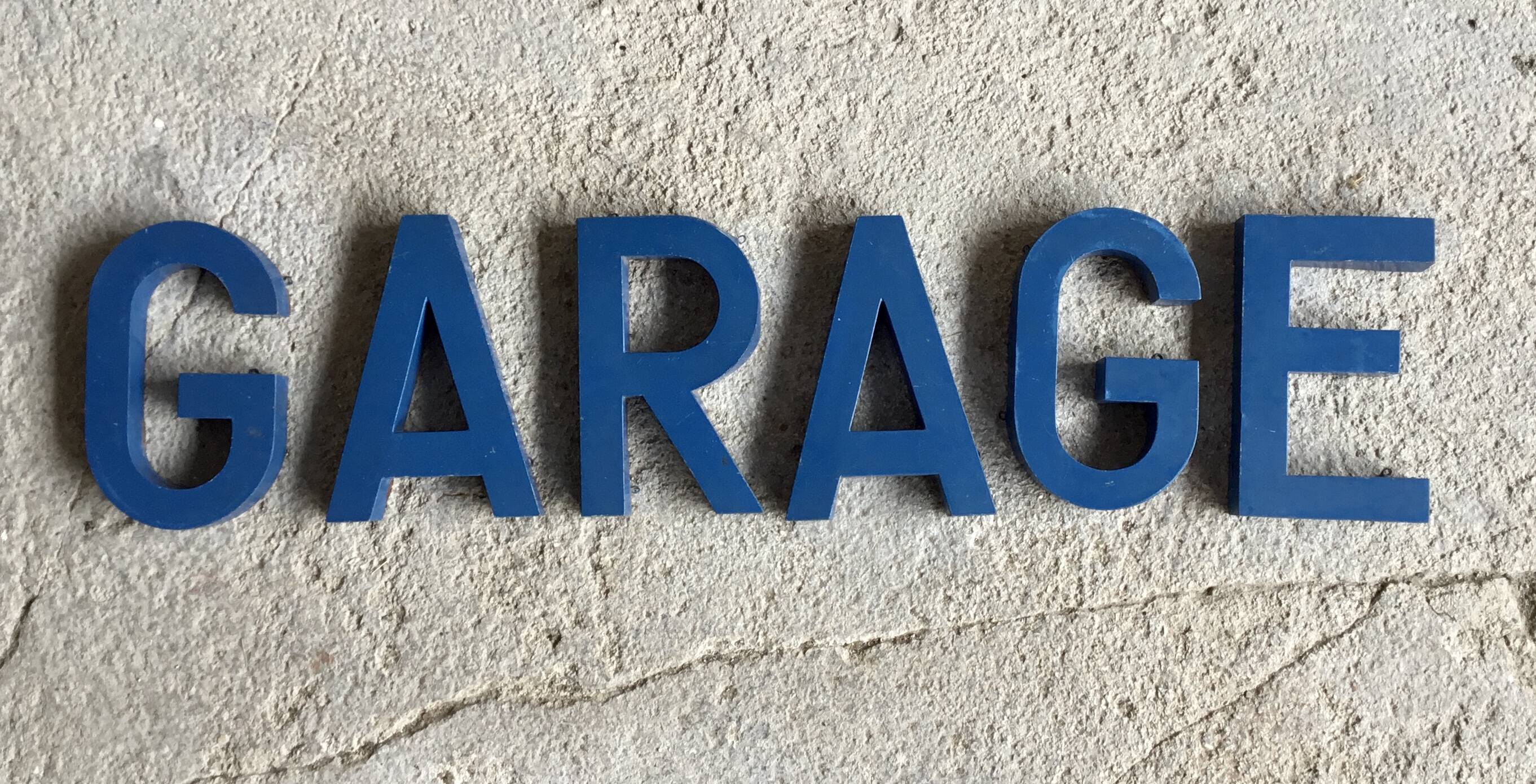 Metal sign letters forming the word GARAGE - vintage workshop
