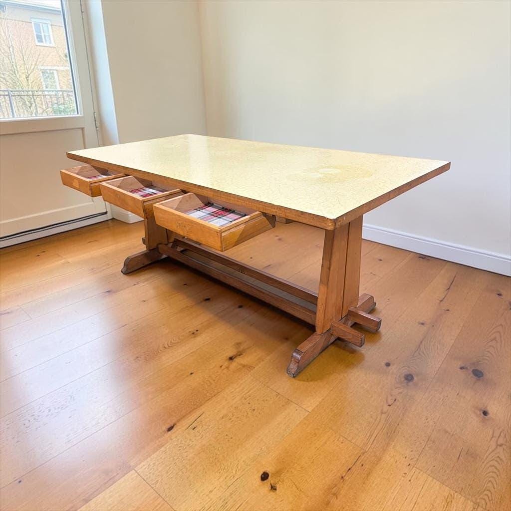 Vintage wooden table with a yellow formica top.