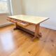 Vintage wooden table with a yellow formica top.