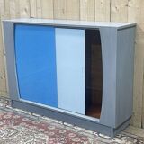Showcase with sliding doors in painted wood