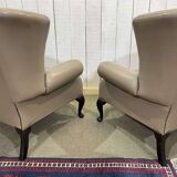 Pair of high-backed Chesterfield armchairs with 1 leather footrest