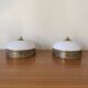 Pair of antique half-spherical ceiling sconces in white glass and brass.