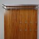 Modernist wall-mounted cloakroom in teak