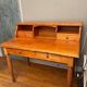 Wooden desk with drawers and storage