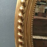 Oval mirror with wooden pediment and gilded stucco oval ice beveled Napoleon III - 80x120cm