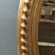 Oval mirror with wooden pediment and gilded stucco oval ice beveled Napoleon III - 80x120cm