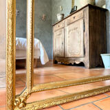 Antique gilded mirror with parcloses from the 19th century.