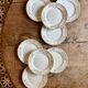 Set of 8 vintage white and gold dessert plates.