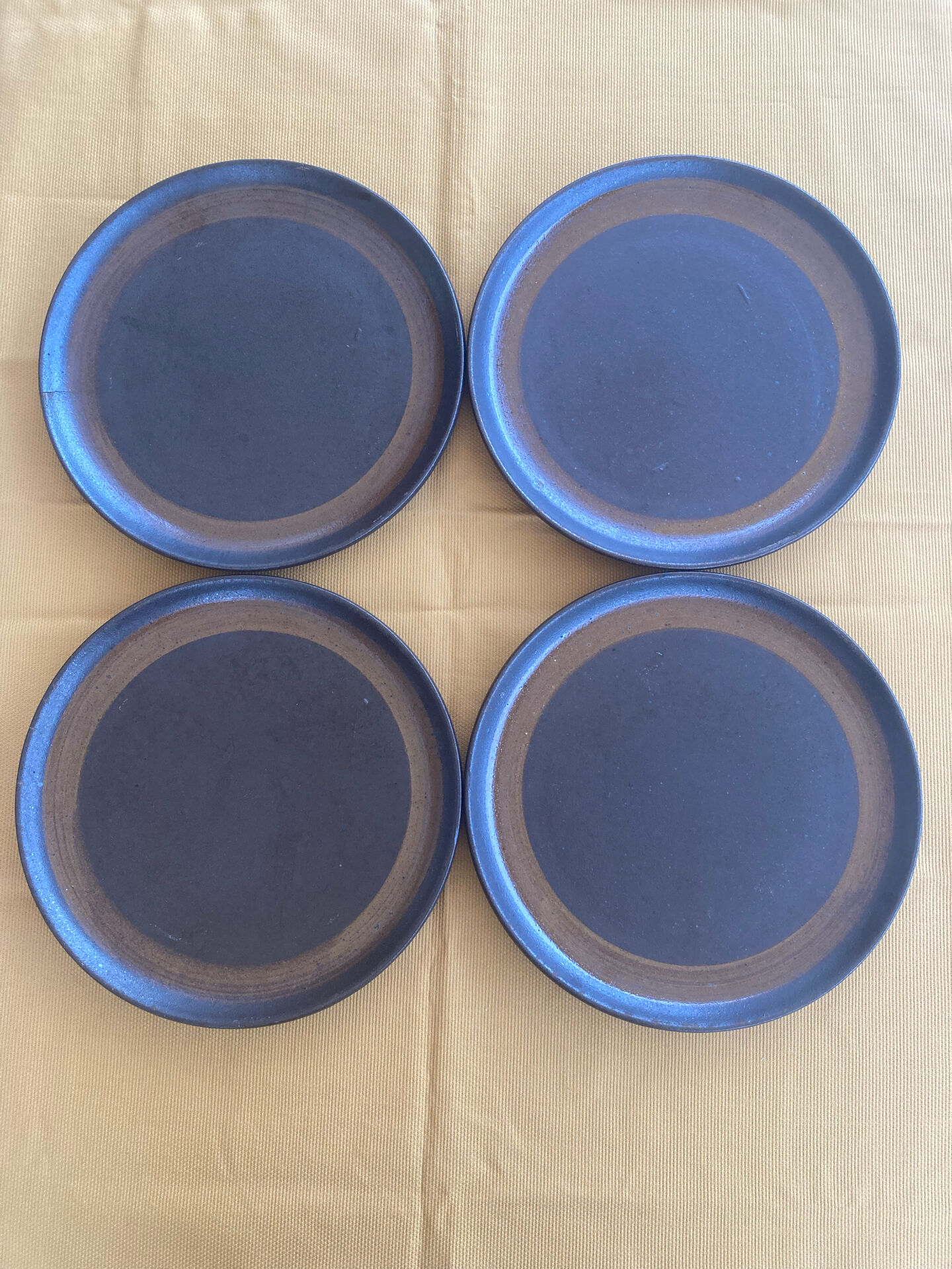 Deep plates made of organic, wild, earthy marsh clay.