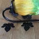 Art-deco style wall lamp with black metal support and foliage and glass paste tulip