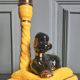 Zoomorphic lamp "poodle" in black, yellow, and gold glazed ceramic.
