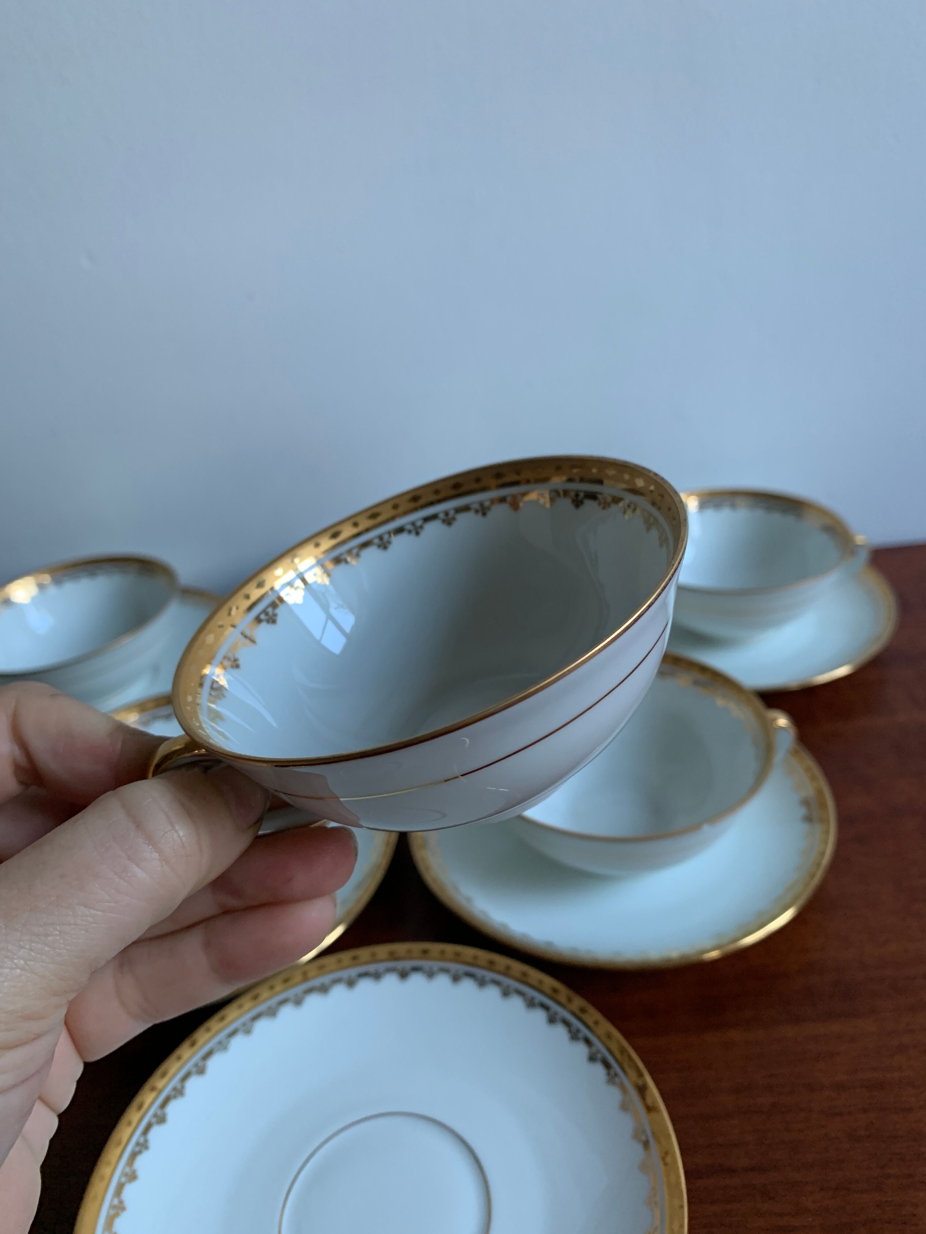 6 cups and golden porcelain saucers