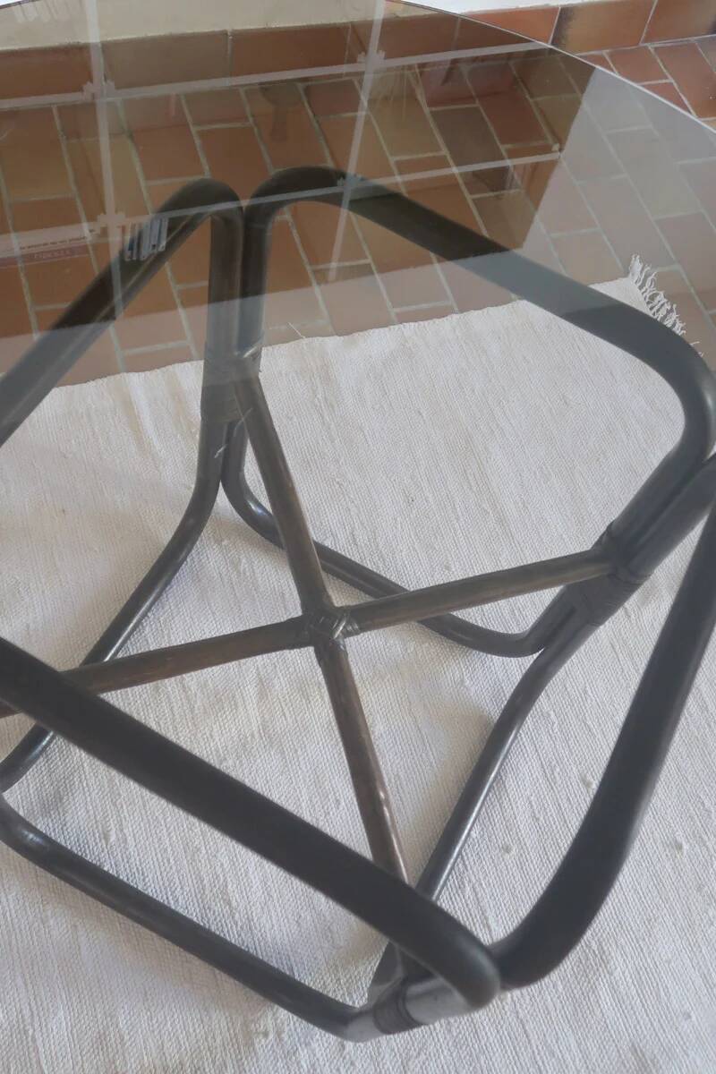 Round dining table in rattan, smoked glass top, 1970s.
