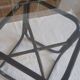 Round dining table in rattan, smoked glass top, 1970s.