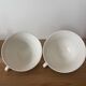 Set of two antique yellow Digoin Sarreguemines cups.