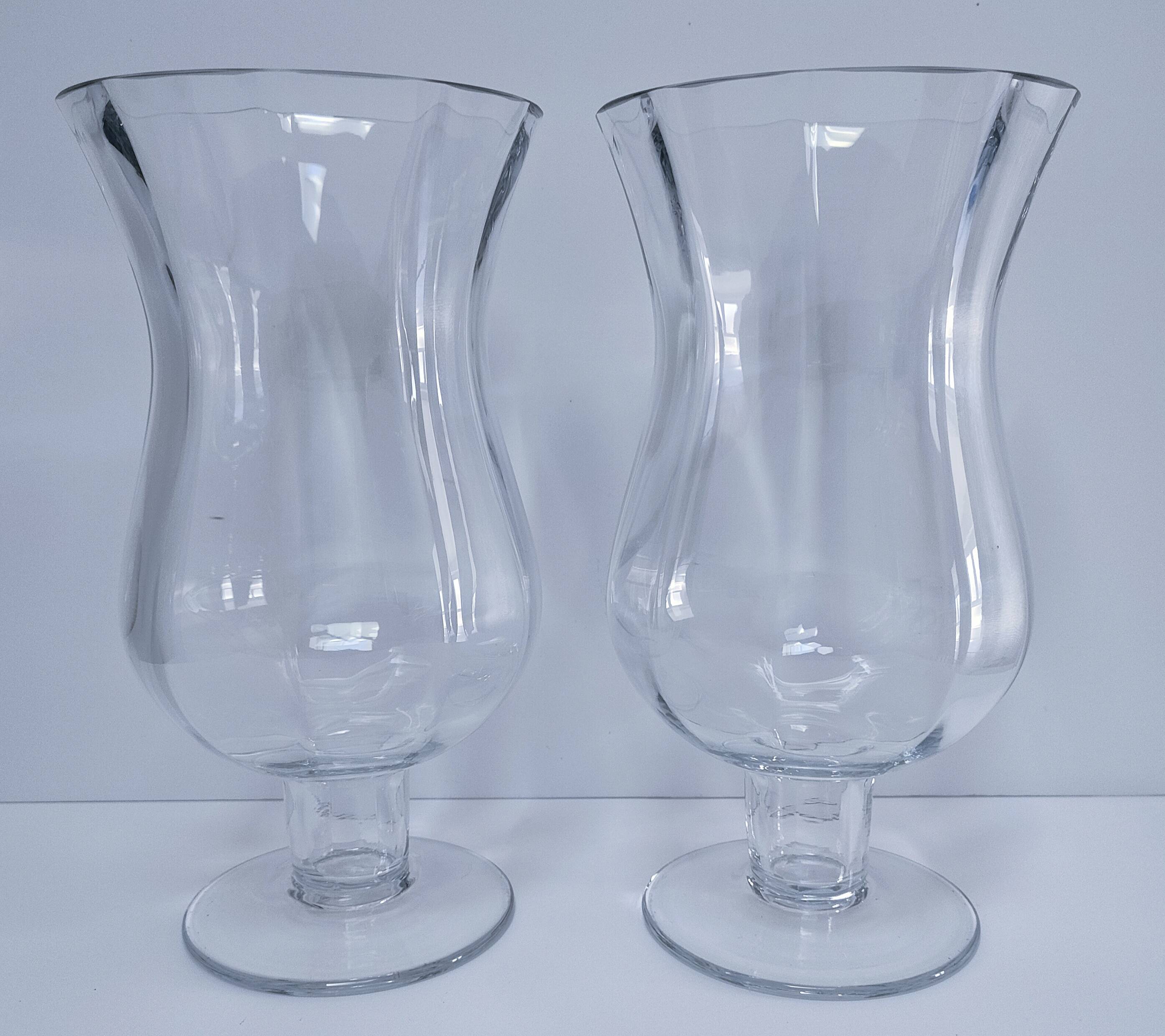 Pair of tall clear glass candlesticks from the early 20th century
