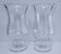 Pair of tall clear glass candlesticks from the early 20th century
