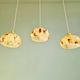 Trio of Art Deco pendant lights in marbled opaline glass, 1920s-30s