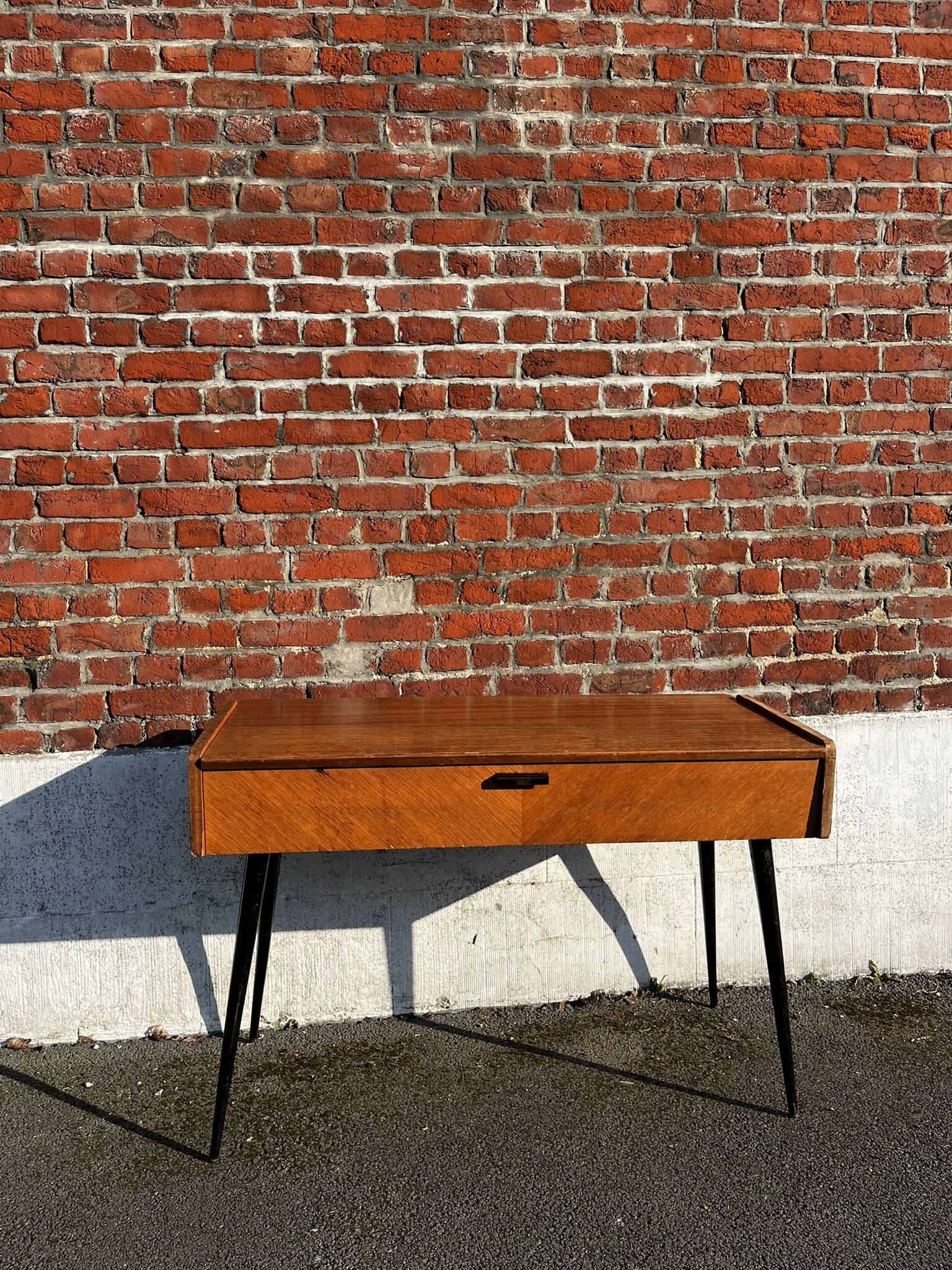 Vintage wooden console/desk with tapered legs.