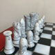 Chess set with ceramic board and pieces.
