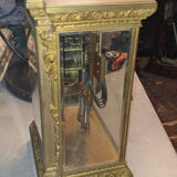 Cage pendulum with its double mercury bulb pendulum.