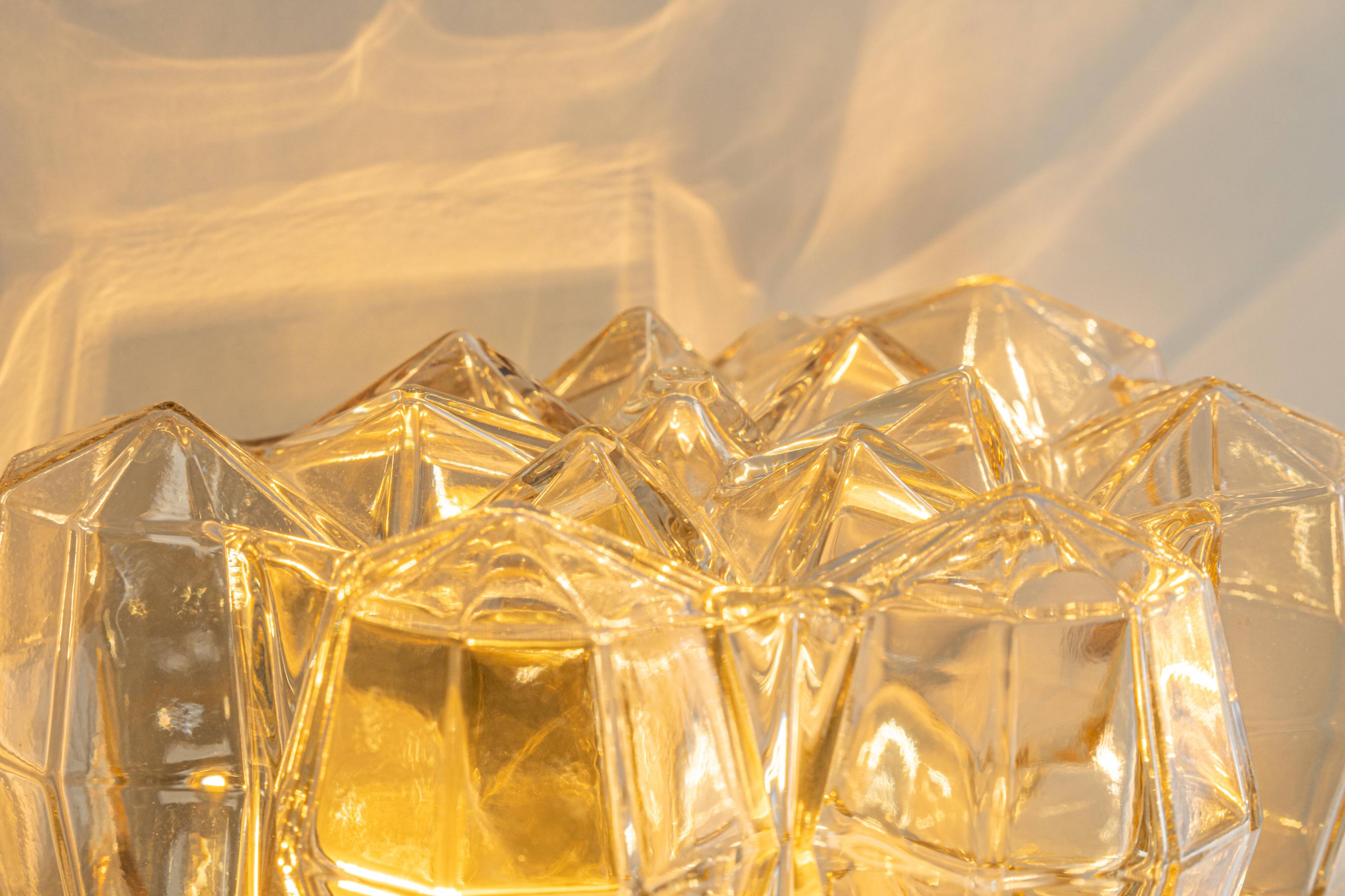 Large amber wall lamp in bubble glass by Helena Tynell, Limburg, Germany.