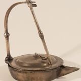 Old oil lamp in golden brass to hang