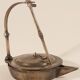 Old oil lamp in golden brass to hang