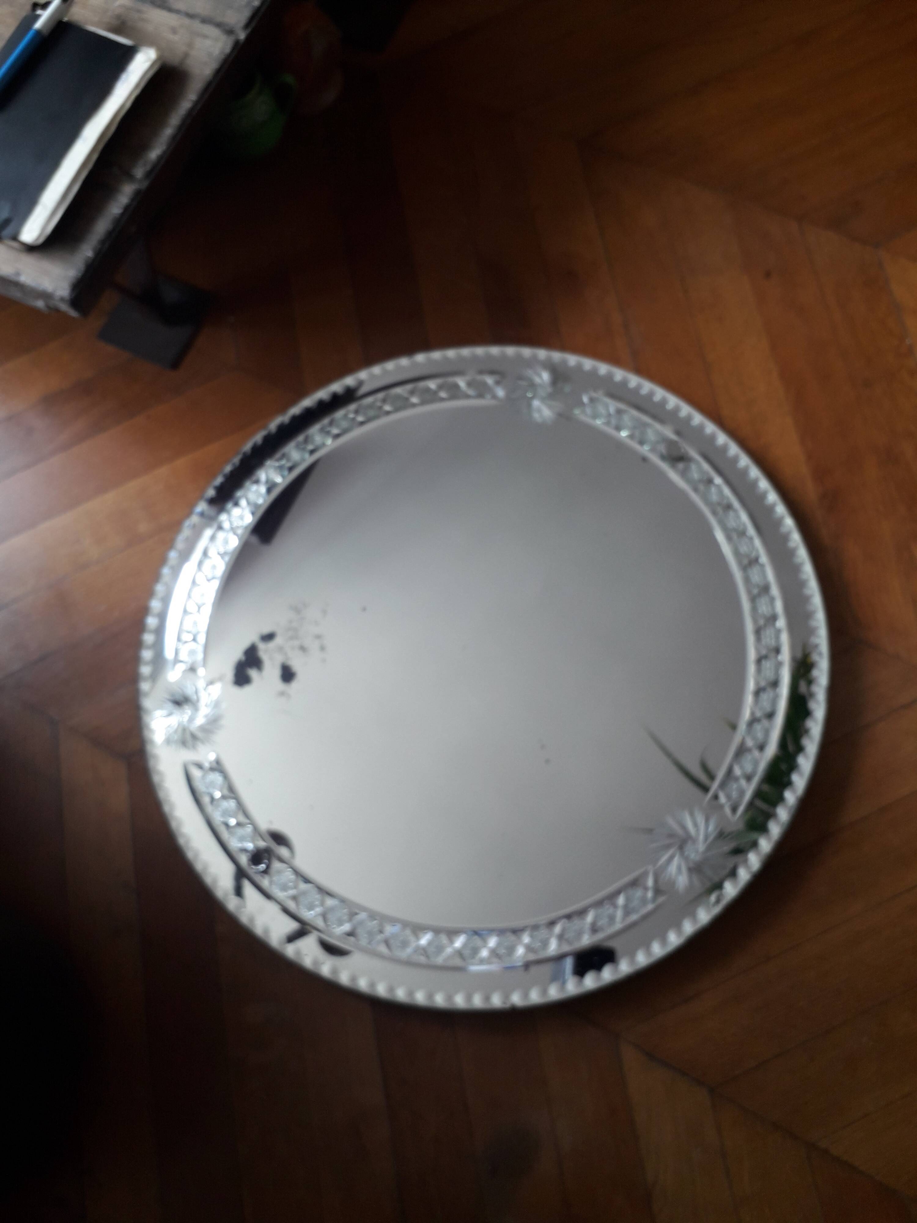 Large old round mirror finely decorated