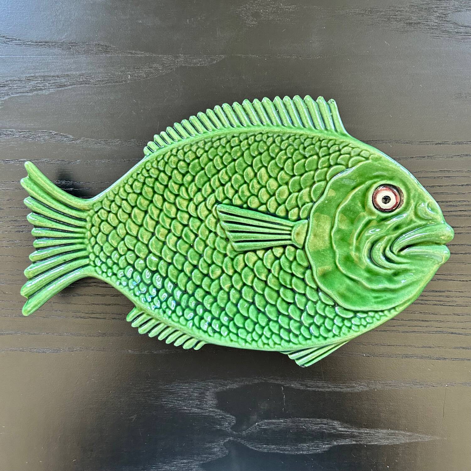 Fish dish in green earthenware