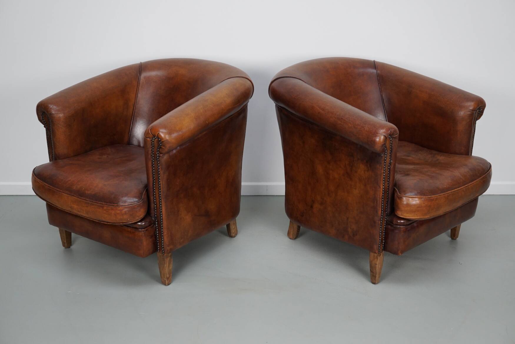Vintage Dutch cognac coloured leather club chair, set of 2 with footstool