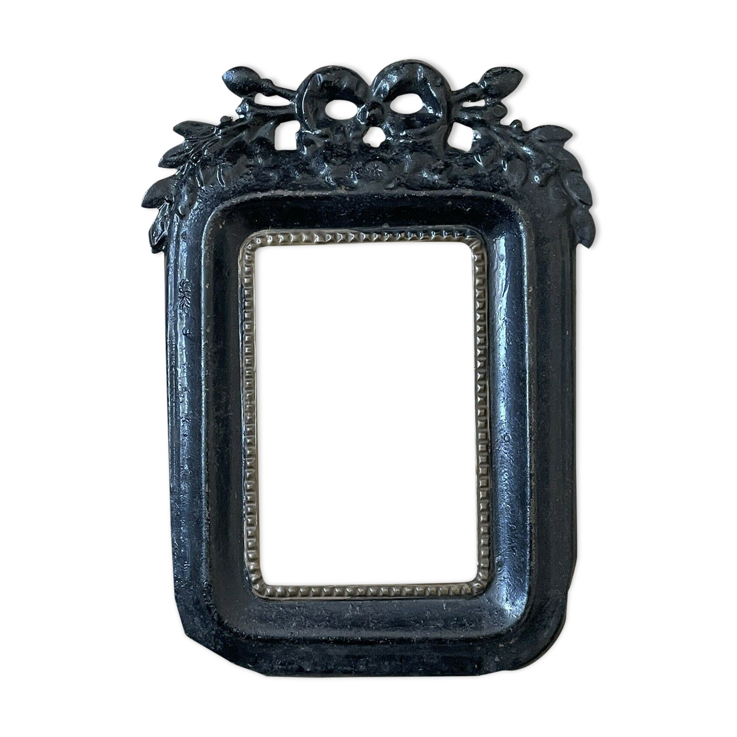 Black metal frame knot and laurel branch