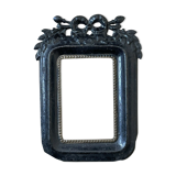 Black metal frame knot and laurel branch