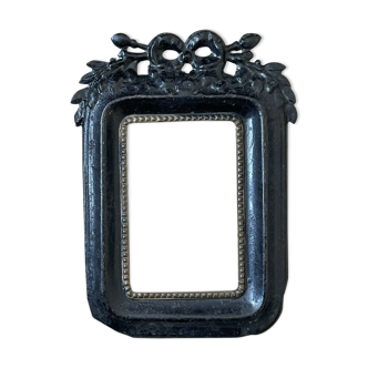 Black metal frame knot and laurel branch