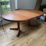 Round teak table with central leg and extension. Denmark 1960