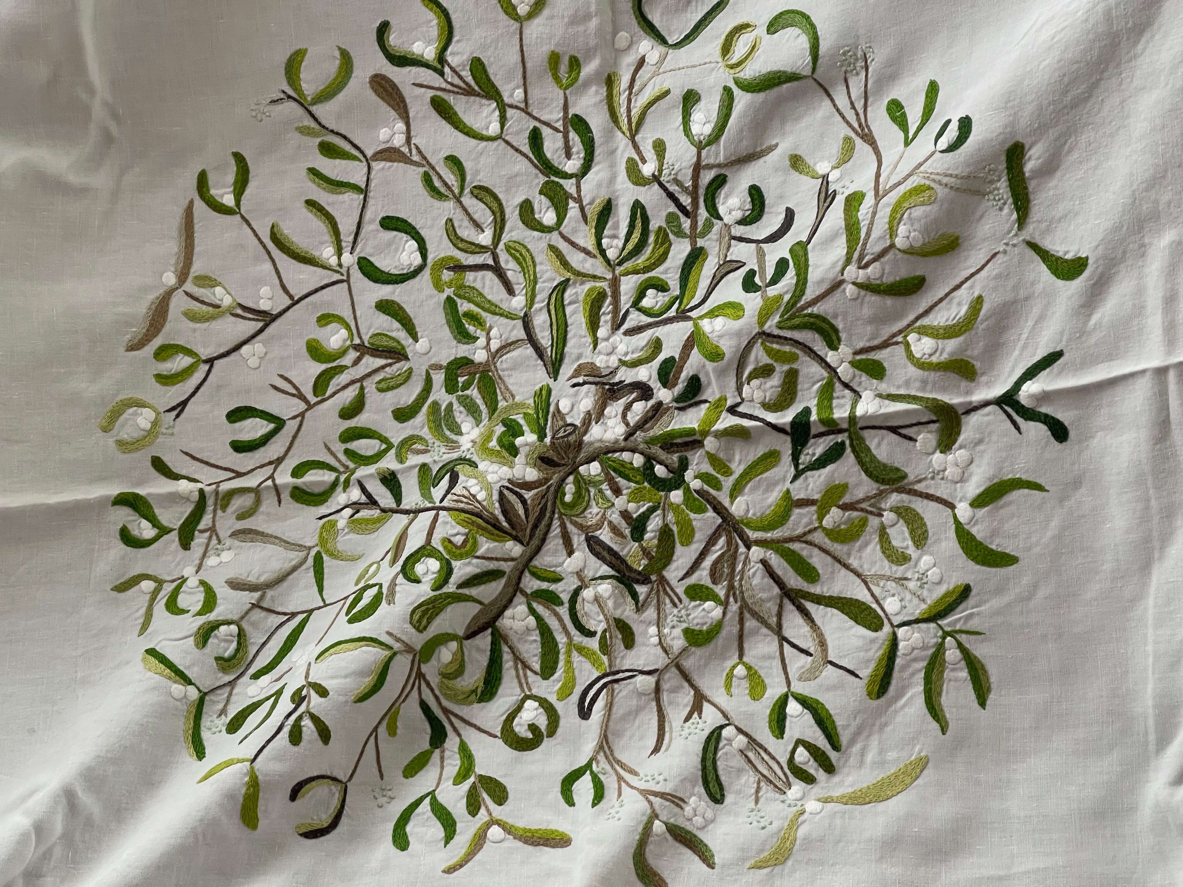 Hand-embroidered tablecloth on rectangular thread canvas